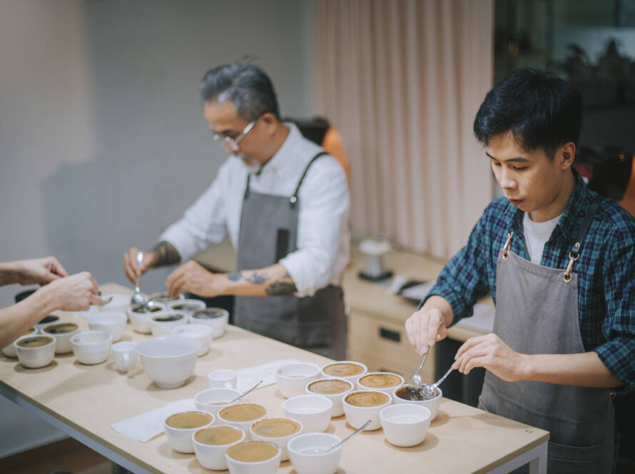 Two men making coffee