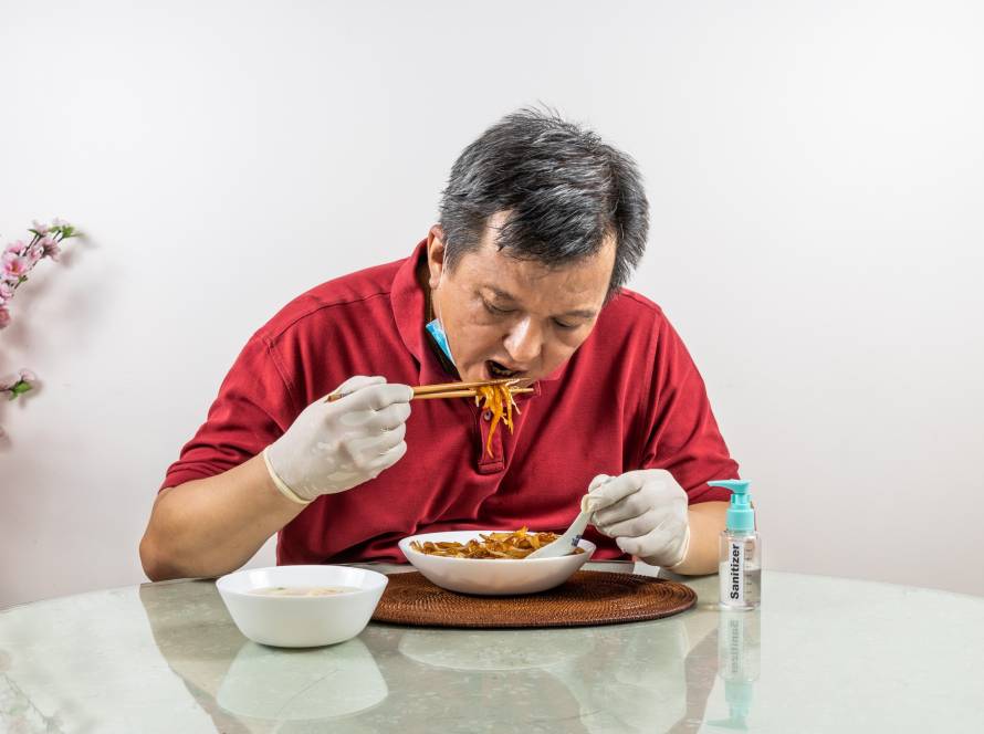 Asian man eating